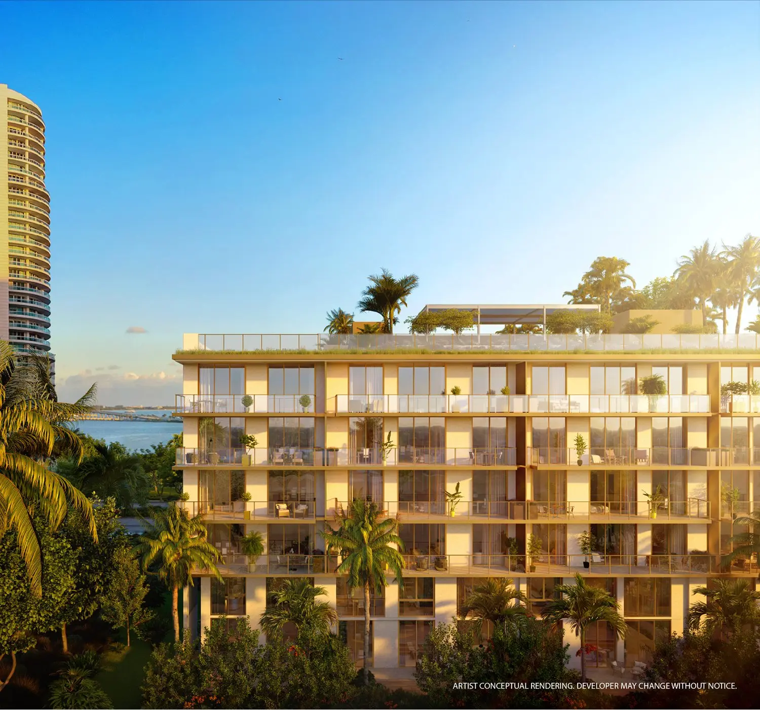 Daytime view of the 2200 Brickell Residences with lush greenery and cityscape.