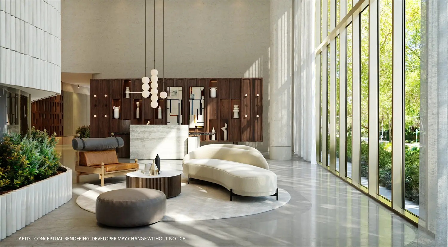 Elegant lobby of 2200 Brickell Residences with modern furniture and large windows.