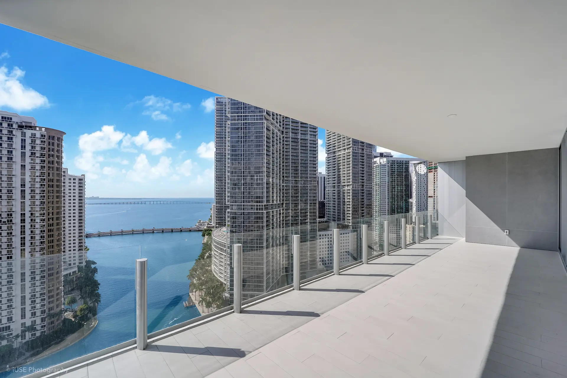 Aston Martin Residences offers an expansive balcony with views of Miami's skyline and waterfront.