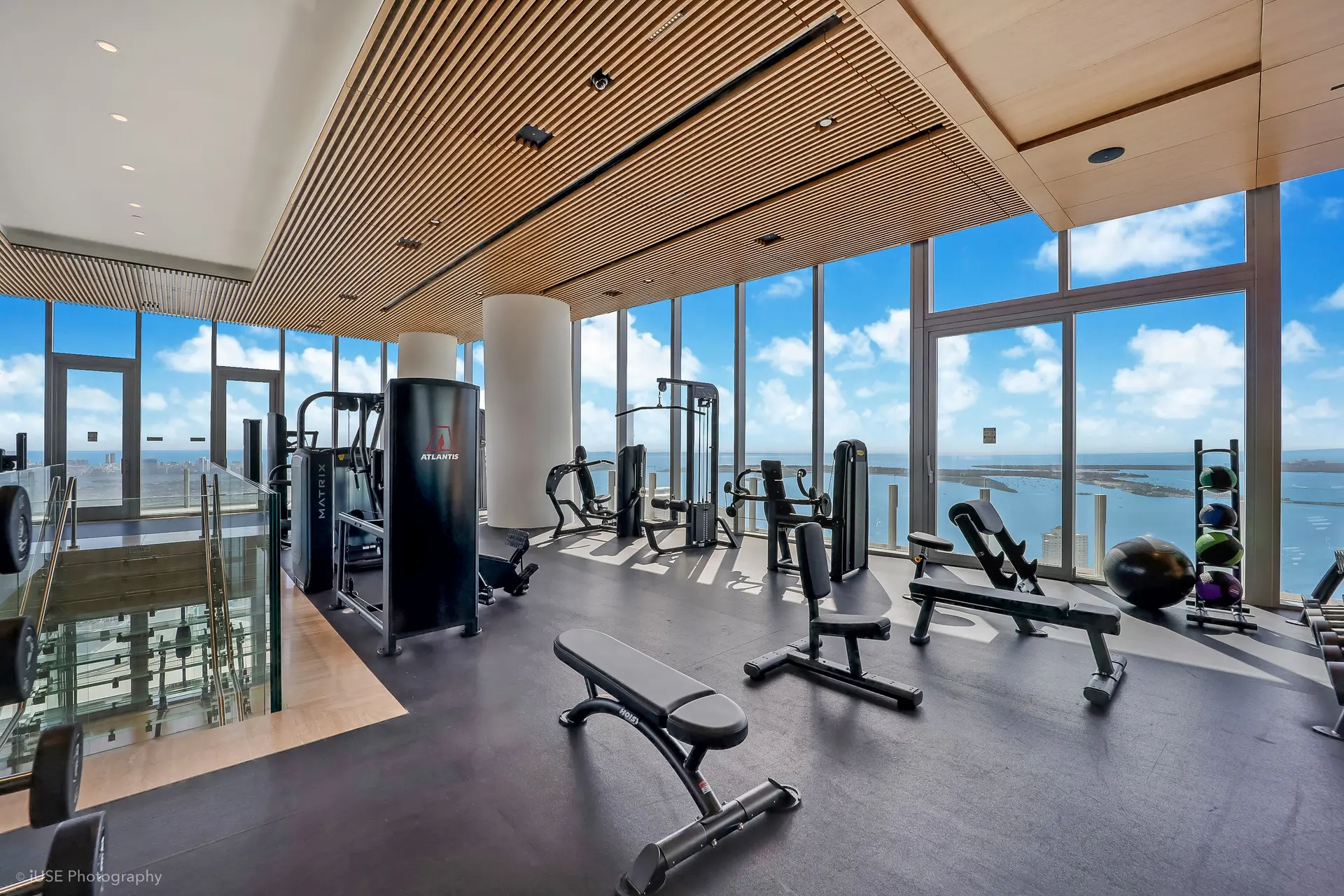 Aston Martin Residences fitness center with expansive ocean views.