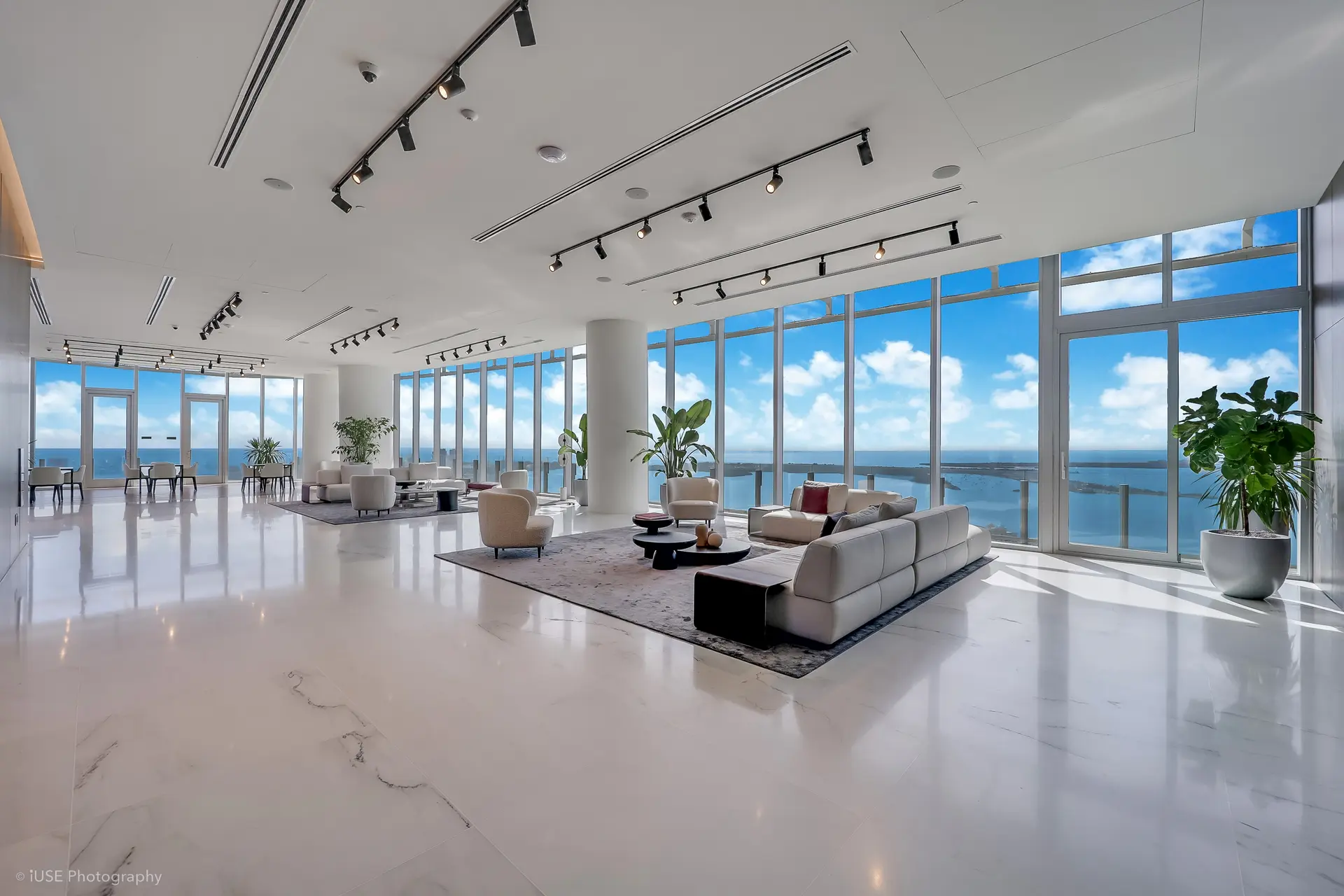 Spacious living area with ocean views at Aston Martin Residences.