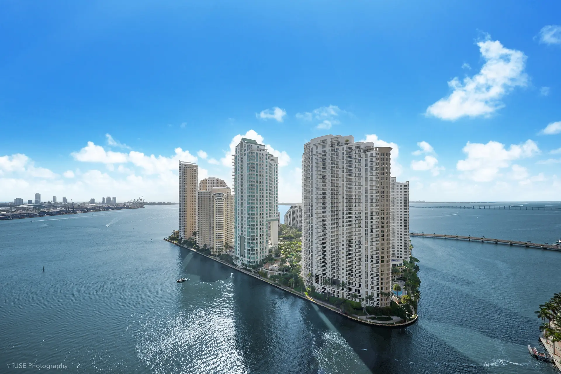 Aston Martin Residences with waterfront and Miami skyline.