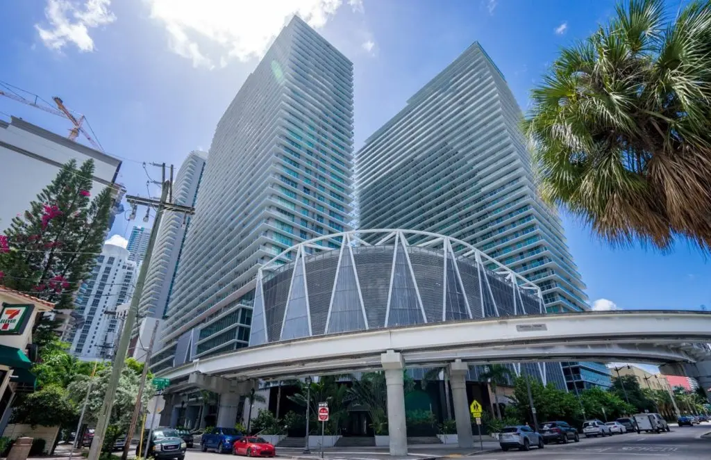 Axis on Brickell South featuring twin high-rise towers against a bright Miami sky