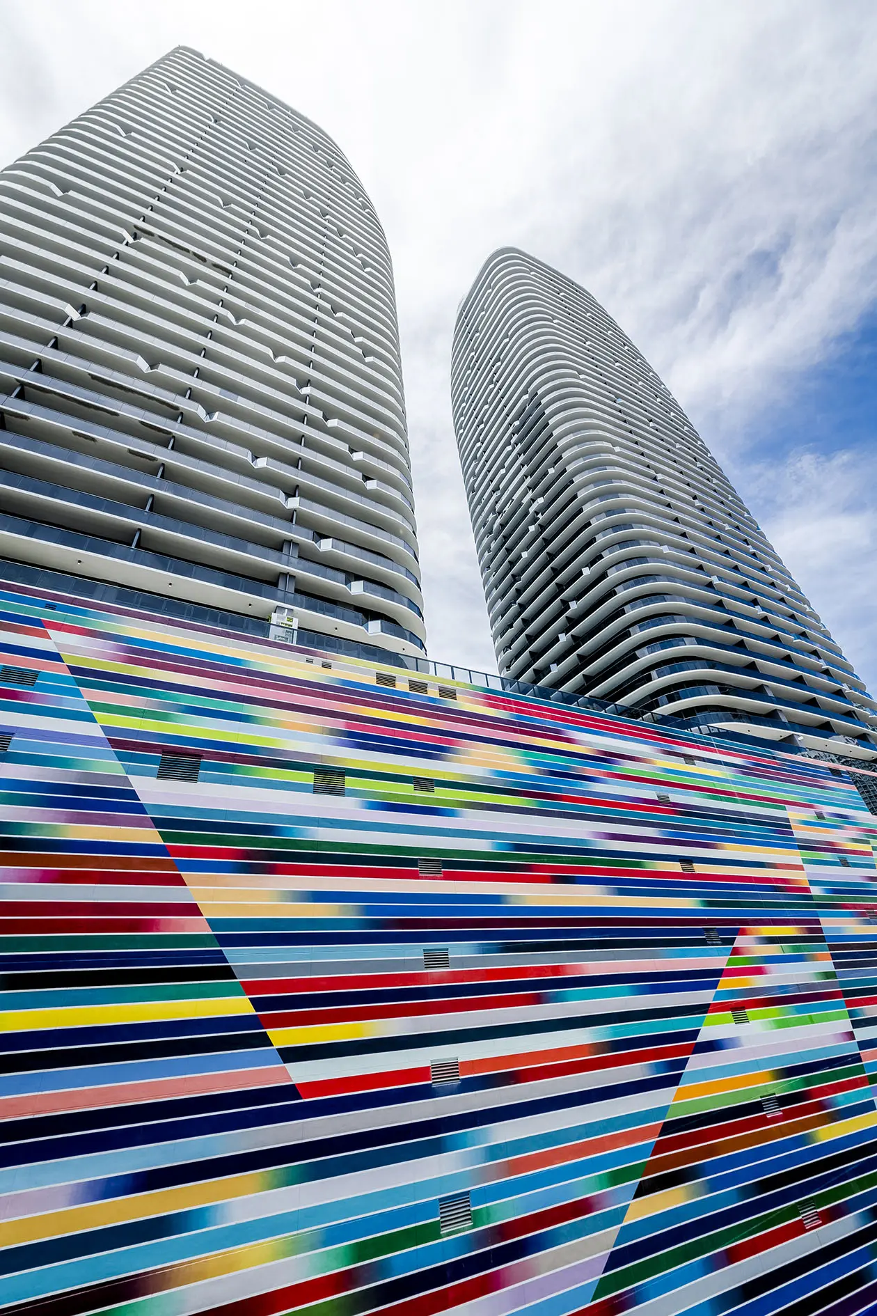 Brickell Heights West towers with a vibrant multicolored mural in Miami.