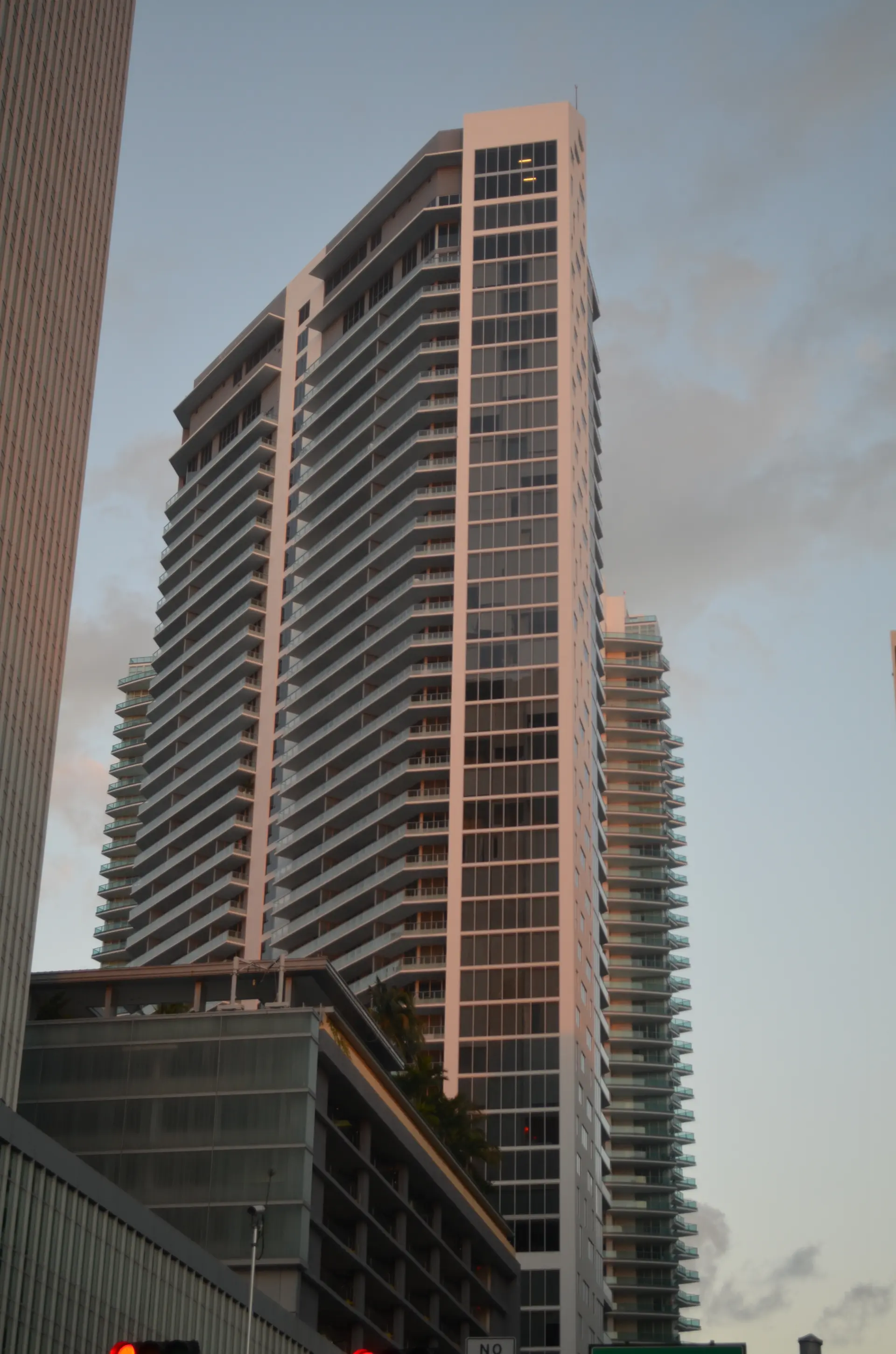 Brickell House luxury condo tower in Miami with sleek glass facade.