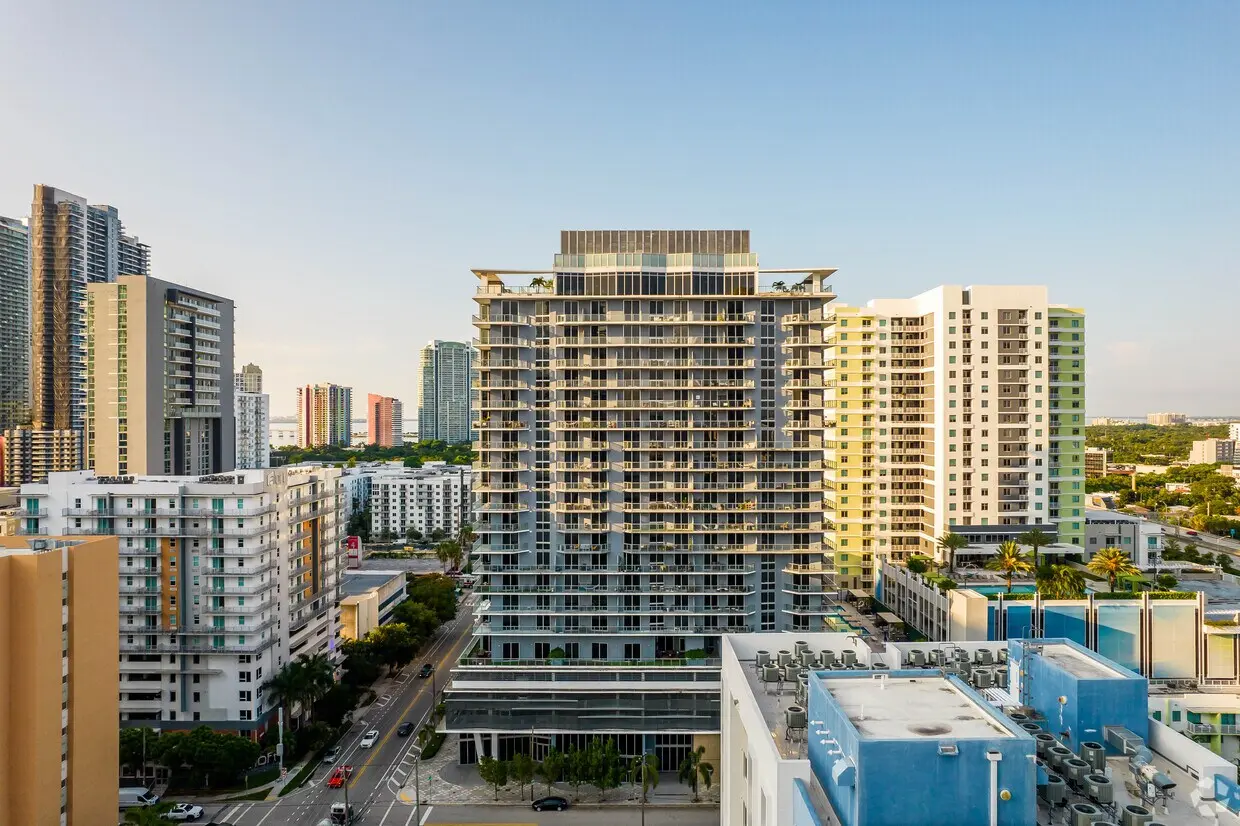 Brickell Ten luxury building exterior in Miami with surrounding cityscape.