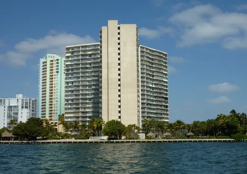 Brickell Townhouse exterior view from the water highlighting its waterfront location.