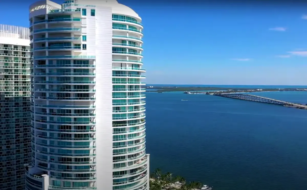 Bristol Tower overlooking the Miami waterfront with a distant bridge.