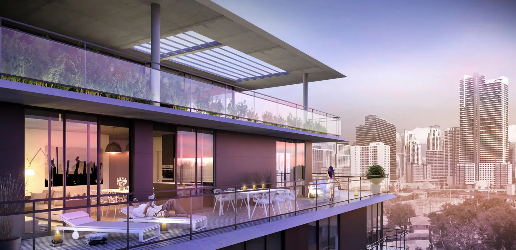 Luxurious balcony view at Cassa Brickell in Miami with modern furniture and city skyline.