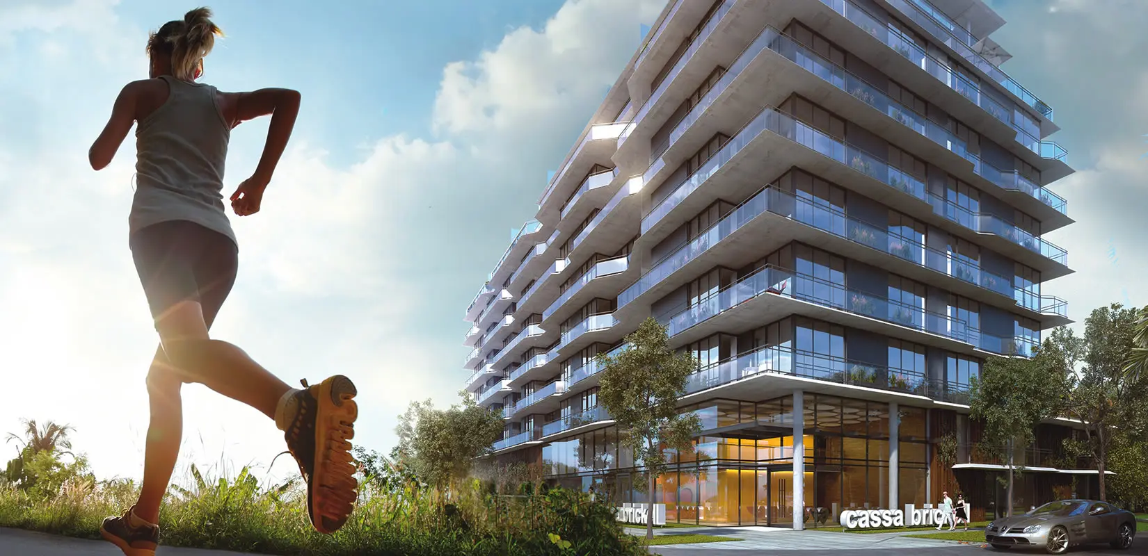 Cassa Brickell modern building exterior with runner in foreground, Miami.