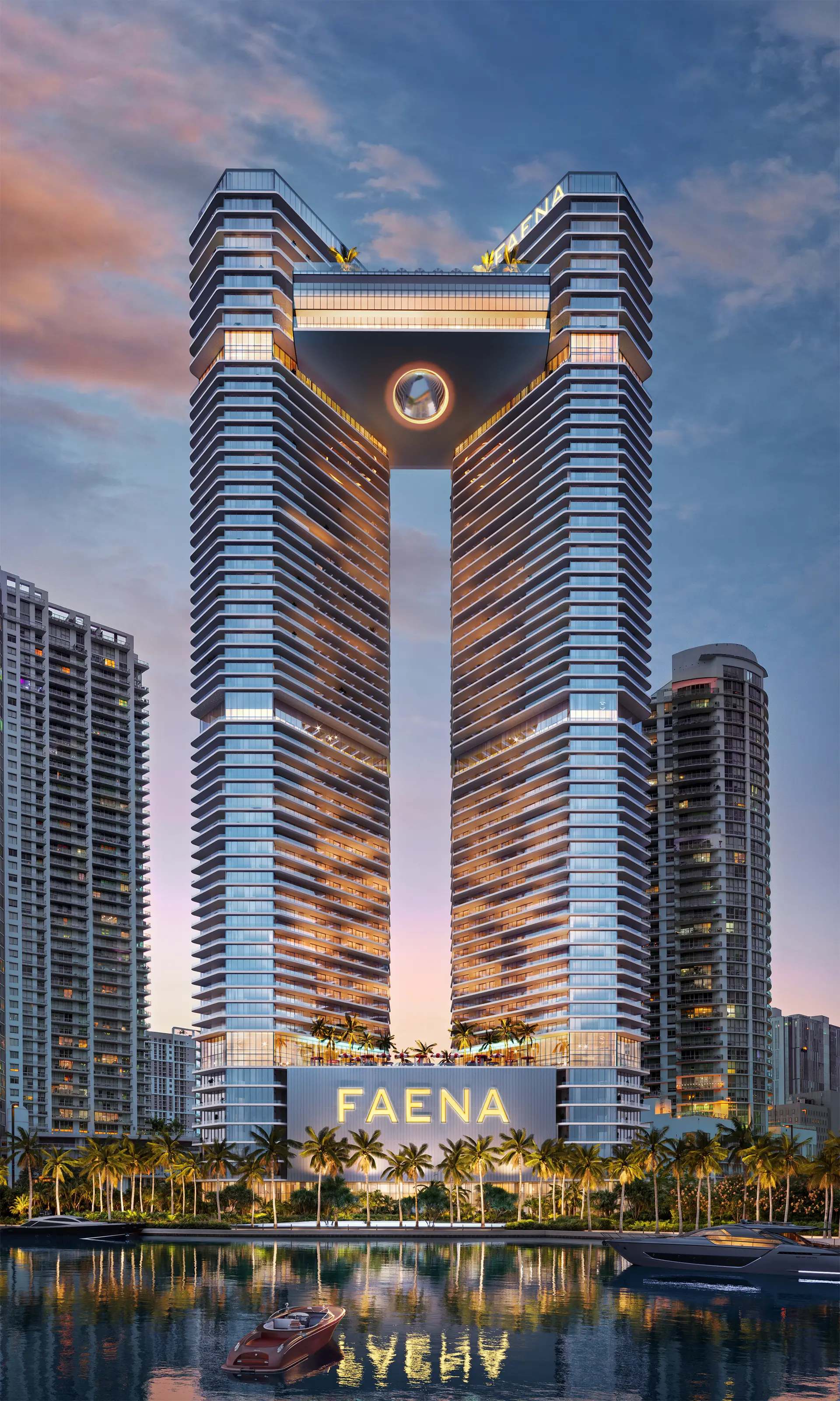 Faena Residences Miami featuring glass towers with a central open space at sunset