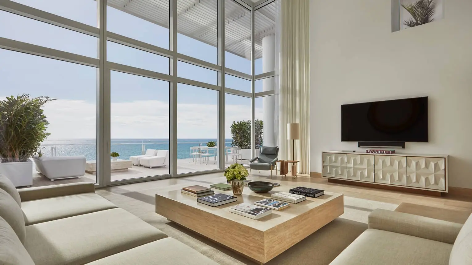 Spacious living room with ocean view at Four Seasons Residences in Miami.