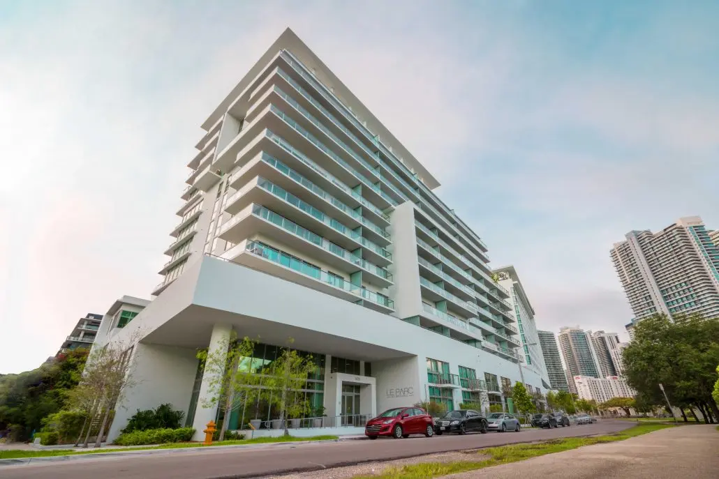 Le Parc at Brickell modern building exterior with balconies and trees.
