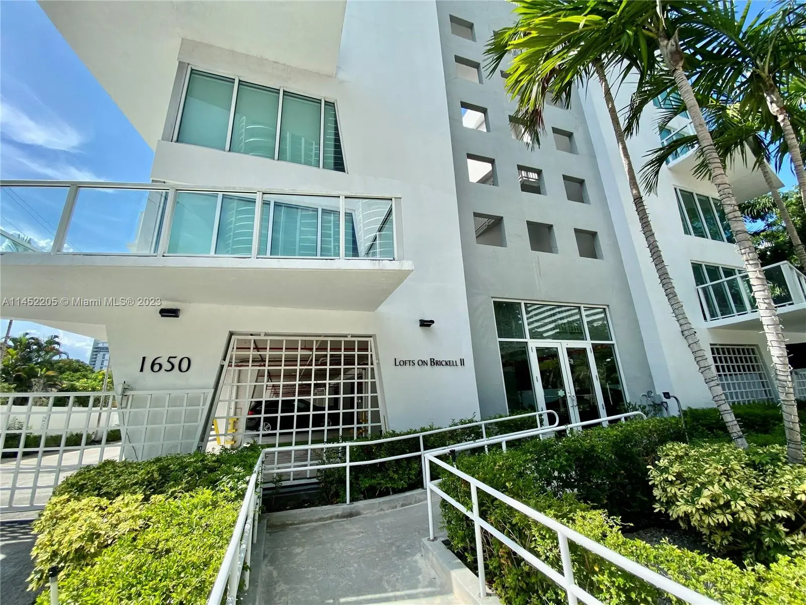 Front entrance of Lofts on Brickell Two showcasing modern architecture in Miami.