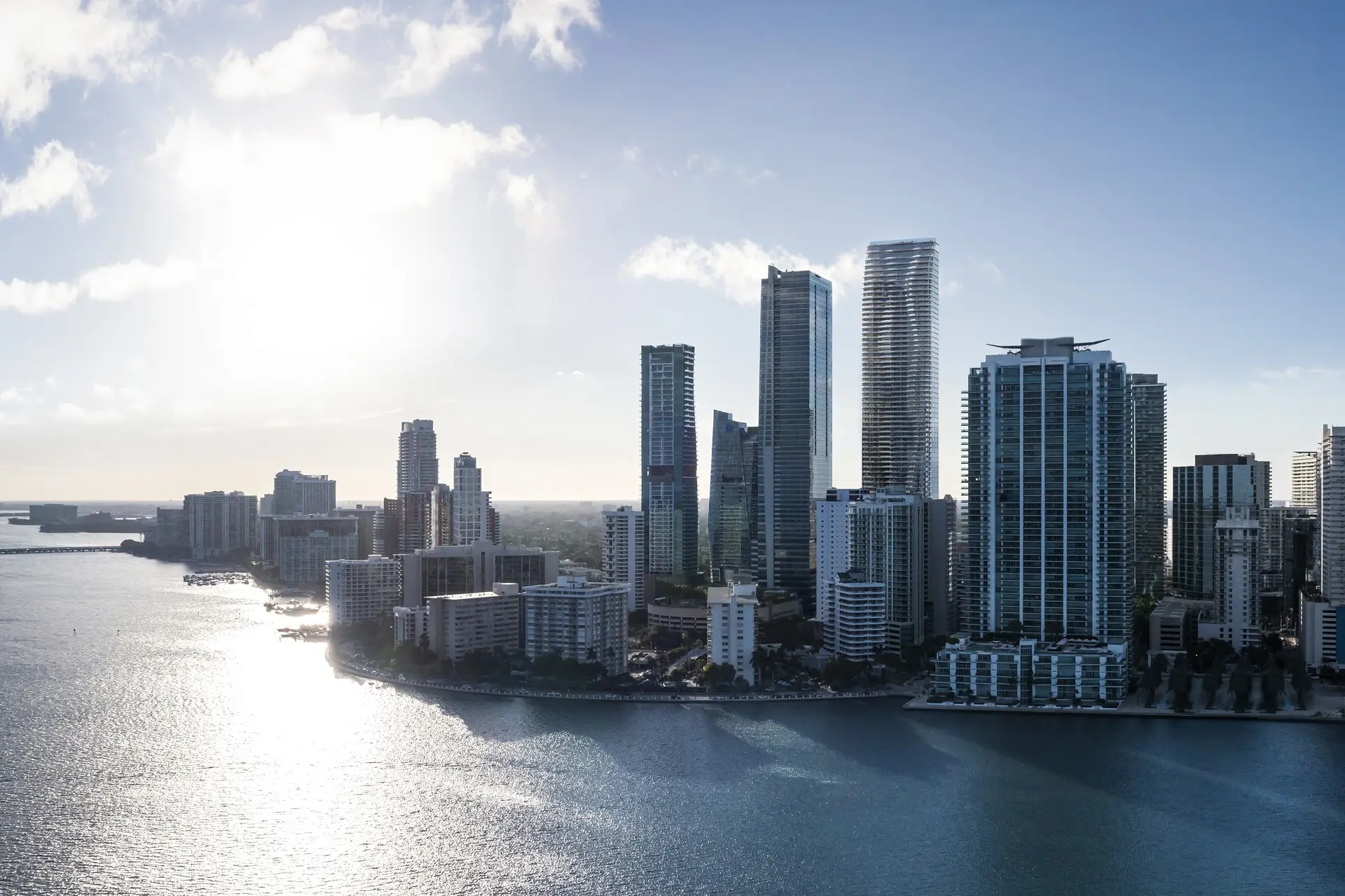 A view of Miami's skyline with high-rise buildings along the waterfront, showcasing Miami Luxury Real Estate.