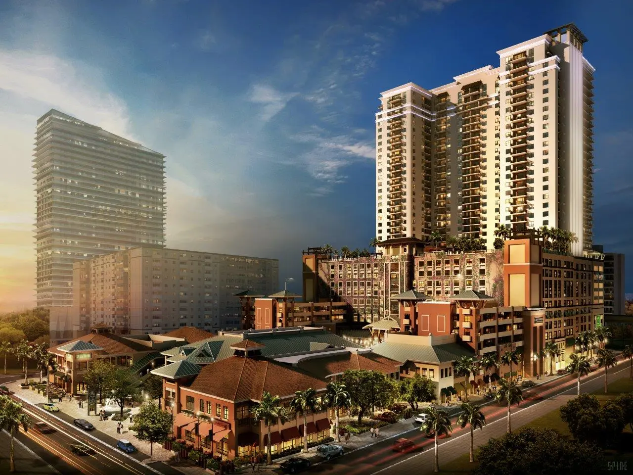 Nine at Mary Brickell Village with illuminated high-rise buildings and lush landscaping.
