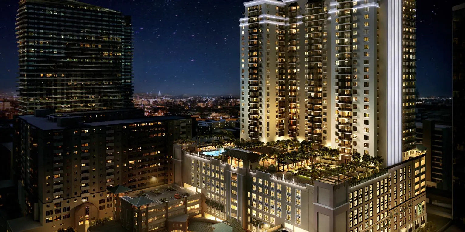 Night view of Nine at Mary Brickell Village with illuminated facade.