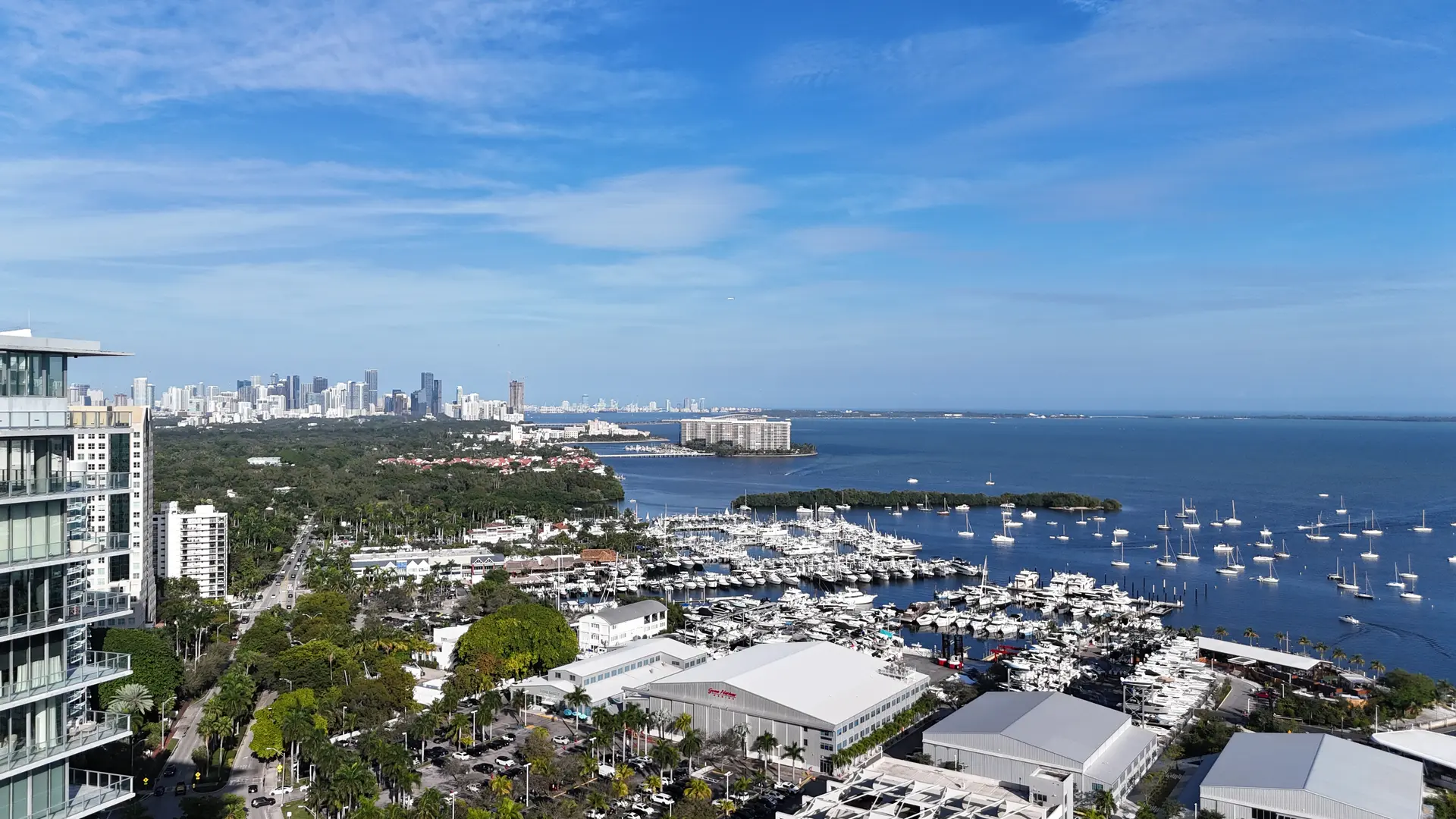 Project Name offers stunning views of Miami skyline and marina.