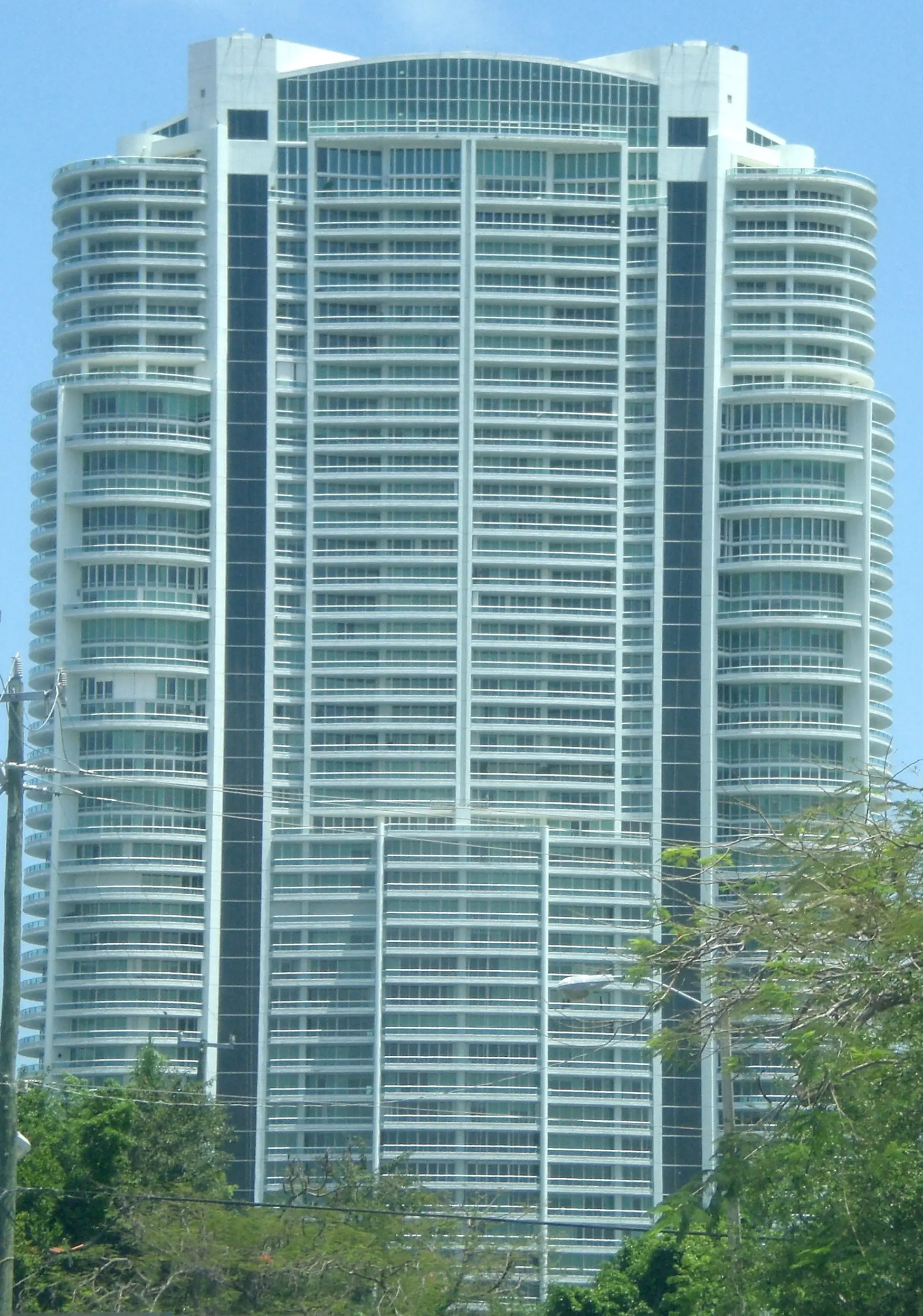 The Santa Maria building exterior showcasing its glass and white façade in Miami.