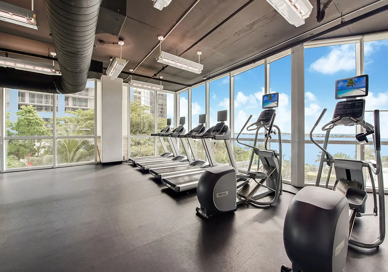 Skyline on Brickell gym with treadmills and city views.