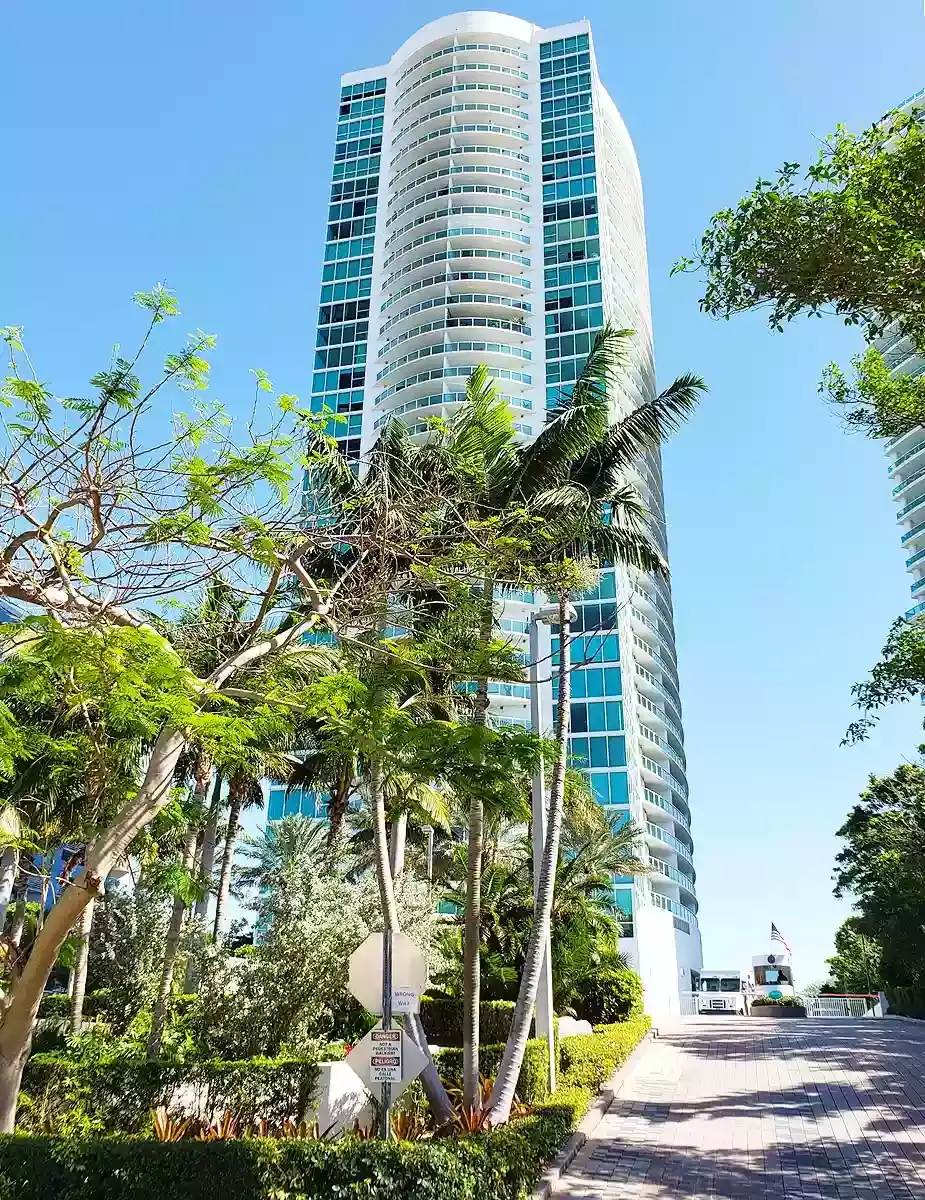 Skyline on Brickell high-rise building with lush landscaping in Miami.
