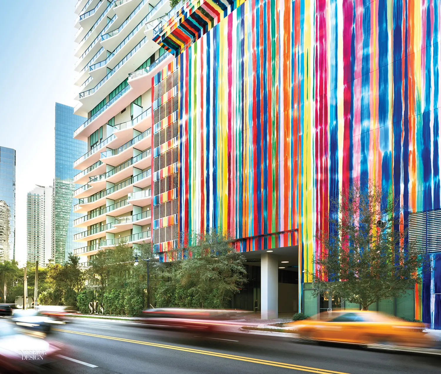 Vibrant exterior of SLS Brickell with rainbow stripes in Miami.