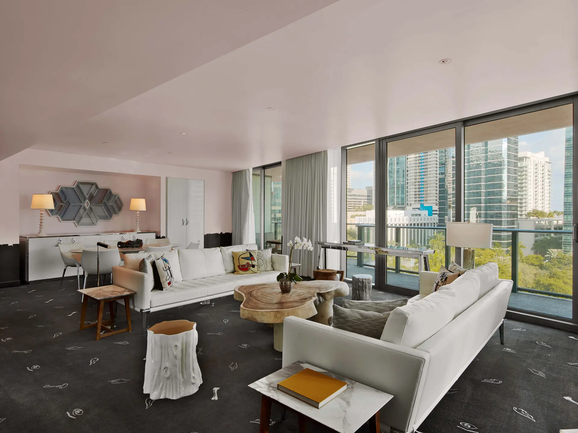 Spacious modern living room with city views at SLS Brickell.