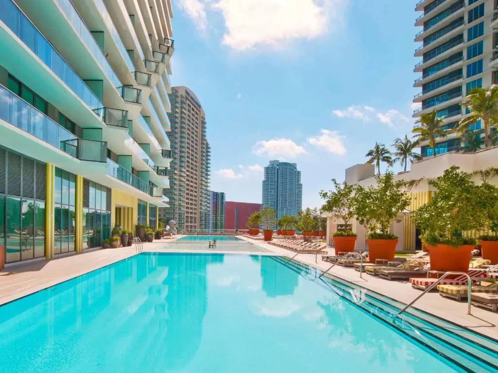 SLS Brickell pool deck with cityscape in Miami.