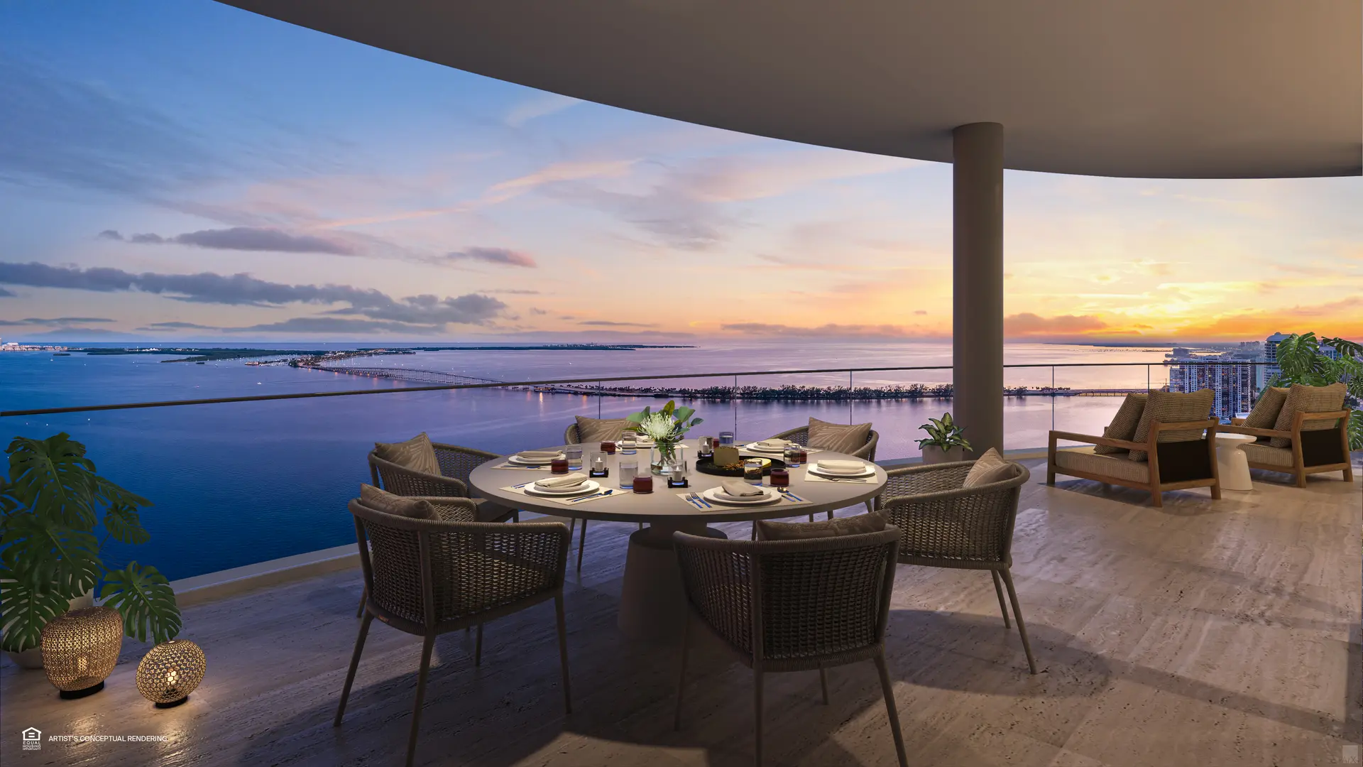 St Regis Brickell terrace with dining area overlooking Miami water at sunset.