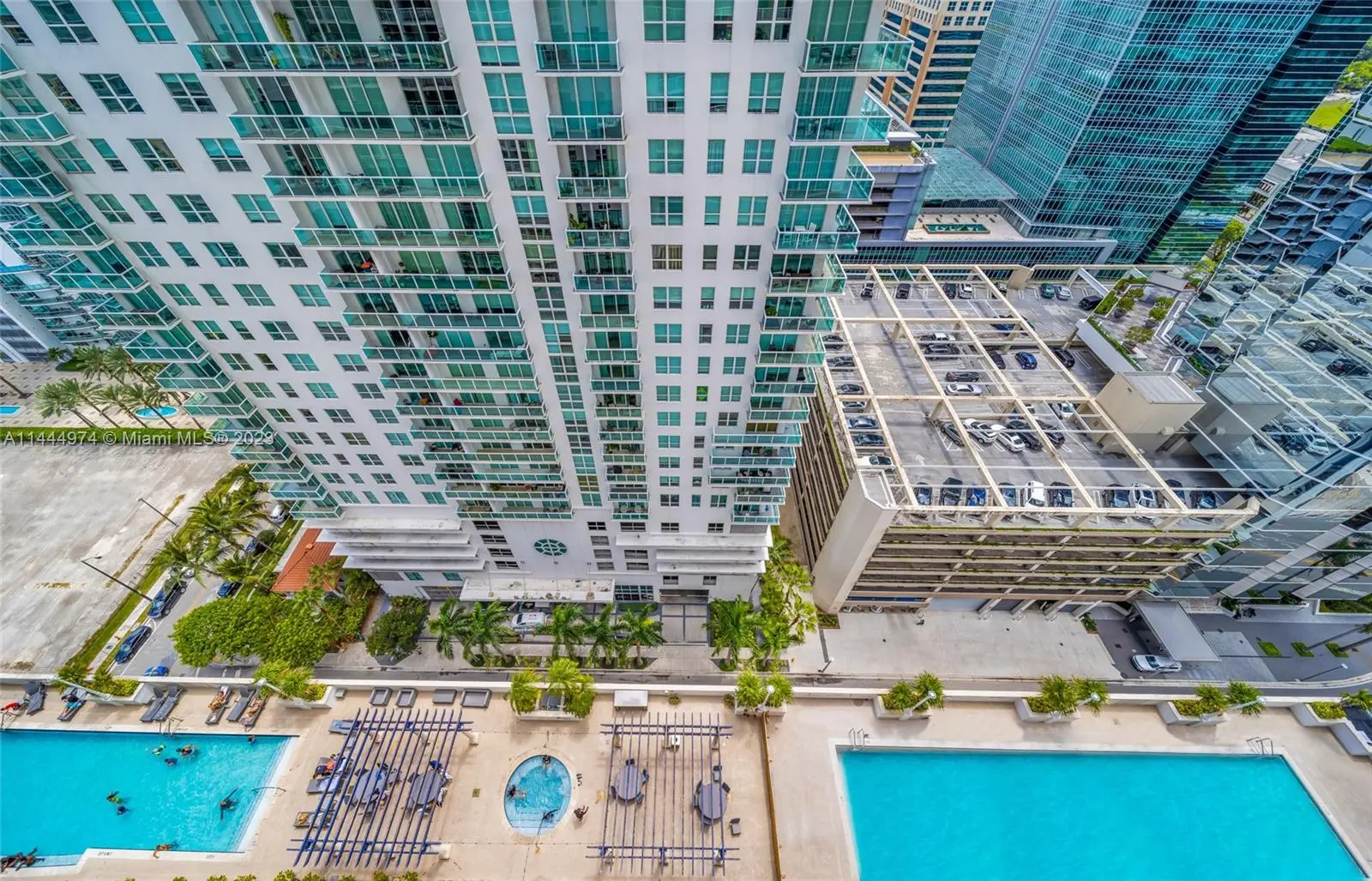 Aerial view of The Club at Brickell Bay with pool and high-rise buildings.
