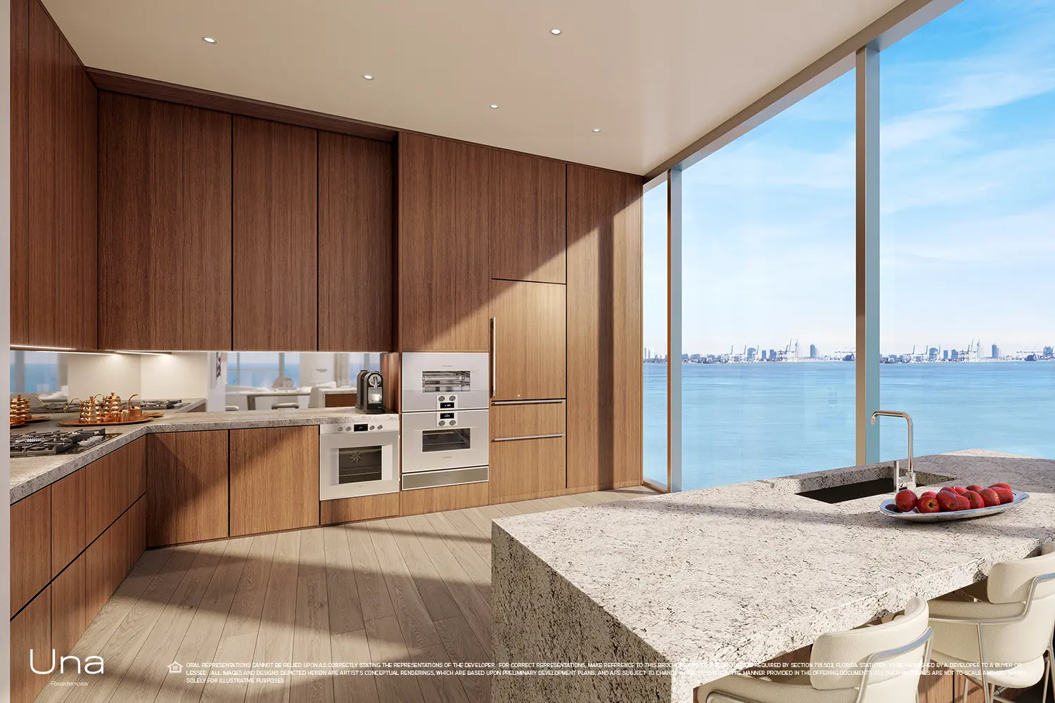 Una features a modern kitchen with ocean views through floor-to-ceiling windows.
