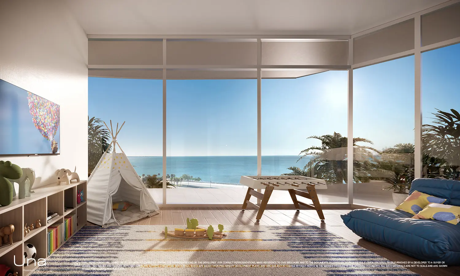 Una Residences playroom with ocean view through large windows in Miami.