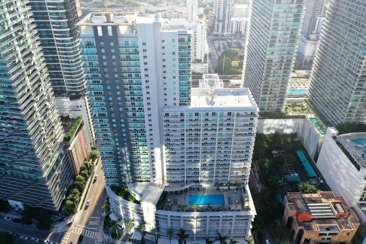 Aerial view of Vue at Brickell surrounded by Miami skyscrapers.